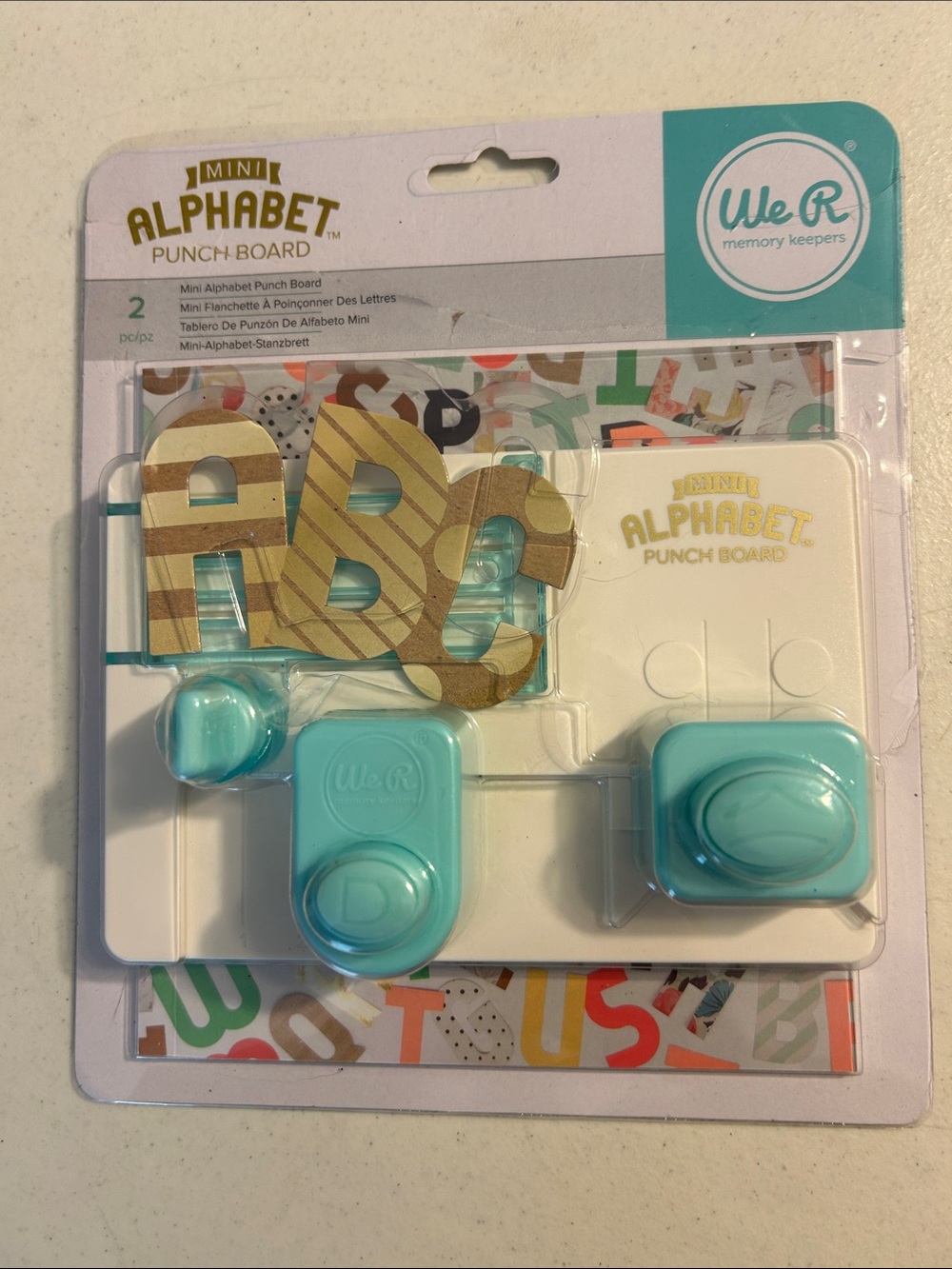Mini alphabet punch board